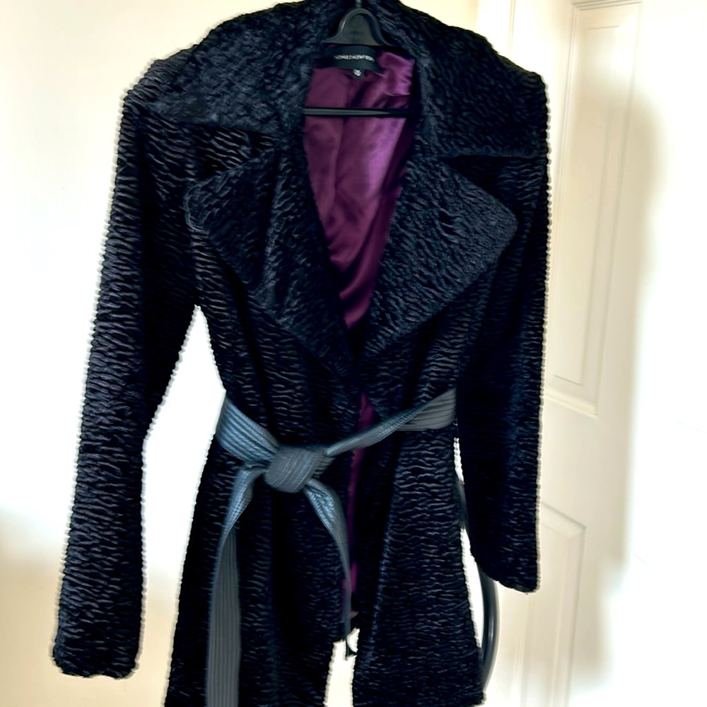 Black jacket in excellent condition with pleather belt. Polyester/ cotton
